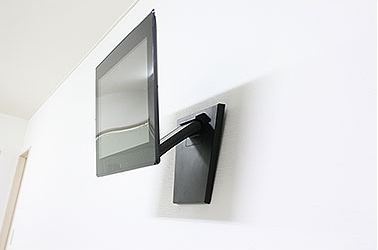 取り付け金具・スタンドを壁掛けで使用したイメージ